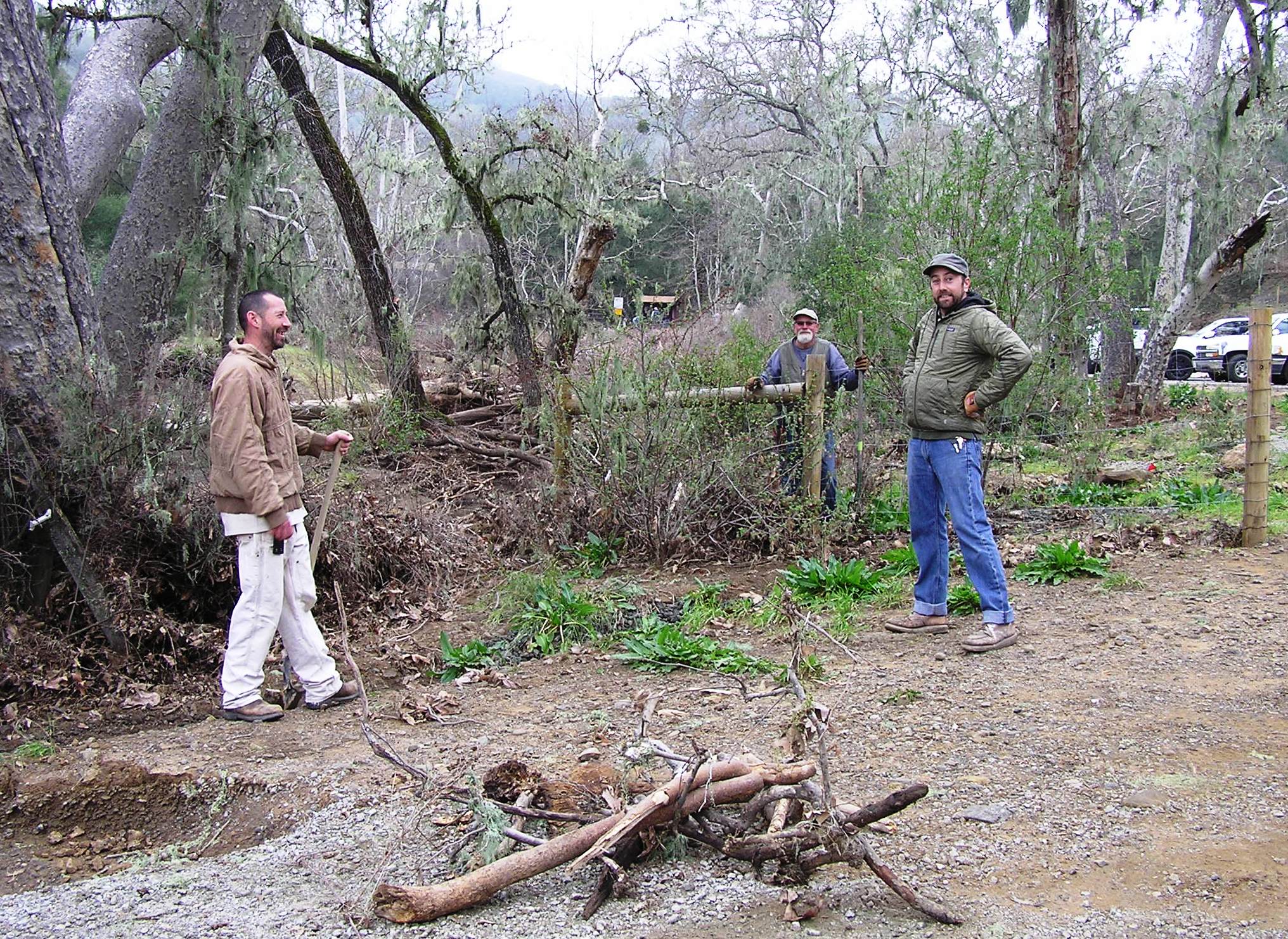 Debris cleanup at the entrance to the trailhead.